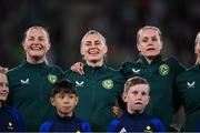 31 July 2023; Republic of Ireland players Kyra Carusa, left, and Sinead Farrelly sing Amhrán na bhFiann before the FIFA Women's World Cup 2023 Group B match between Republic of Ireland and Nigeria at Brisbane Stadium in Brisbane, Australia. Photo by Stephen McCarthy/Sportsfile