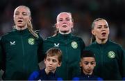 31 July 2023; Republic of Ireland players, from left, Louise Quinn, Courtney Brosnan and Katie McCabe sing Amhrán na bhFiann before the FIFA Women's World Cup 2023 Group B match between Republic of Ireland and Nigeria at Brisbane Stadium in Brisbane, Australia. Photo by Stephen McCarthy/Sportsfile