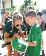 31 July 2023; Lily Agg of Republic of Ireland signs an autograph for a young supporter during a team walk before the FIFA Women's World Cup 2023 Group B match between Republic of Ireland and Nigeria at Brisbane Stadium in Brisbane, Australia. Photo by Stephen McCarthy/Sportsfile