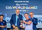 28 July 2023; New York captain James Breen accepts the trophy from Uachtarán Chumann Lúthchleas Gael Larry McCarthy after the Hurling International Cup Final Séamus Howlin Cup match between New York and Pearse Óg San Francisco on day five of the FRS Recruitment GAA World Games 2023 at Celtic Park in Derry. Photo by Piaras Ó Mídheach/Sportsfile