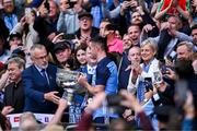 30 July 2023; Uachtarán Chumann Lúthchleas Gael Larry McCarthy presents the Sam Maguire Cup to Dublin captain James McCarthy after the GAA Football All-Ireland Senior Championship final match between Dublin and Kerry at Croke Park in Dublin. Photo by Piaras Ó Mídheach/Sportsfile