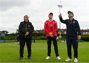3 August 2023; North West Warriors captain Andy McBrine, right, makes the toss watched by Munster captain Peter Moor and match referee Phil Thompson before the Rario Inter-Provincial Trophy 2023 match between North West Warriors and Munster Reds at Pembroke Cricket Club in Dublin. Photo by Sam Barnes/Sportsfile
