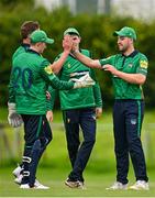 3 August 2023; Jared Wilson of North West Warriors, right, is congratulated by team-mates after after catching out Murray Commins of Munster Reds during the Rario Inter-Provincial Trophy 2023 match between North West Warriors and Munster Reds at Pembroke Cricket Club in Dublin. Photo by Sam Barnes/Sportsfile