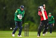 3 August 2023; Tyrone Kane of Munster Reds bats watched by North West Warriors wicketkeeper Stephen Doheny during the Rario Inter-Provincial Trophy 2023 match between North West Warriors and Munster Reds at Pembroke Cricket Club in Dublin. Photo by Sam Barnes/Sportsfile