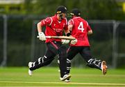 3 August 2023; Alistair Frost of Munster Reds, left, and team-mate Tyrone Kane run a single during the Rario Inter-Provincial Trophy 2023 match between North West Warriors and Munster Reds at Pembroke Cricket Club in Dublin. Photo by Sam Barnes/Sportsfile