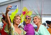 3 August 2023; Racegoers, from left, Pam Richardson-Hoare, from Galway, Fiona Morgan Coleman, from Shurle, Mayo, and Caroline Downey, from Galway, on day four of the Galway Races Summer Festival at Ballybrit Racecourse in Galway. Photo by Seb Daly/Sportsfile