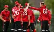 3 August 2023; Munster players celebrate the wicket of Liam Doherty of North West Warriors during the Rario Inter-Provincial Trophy 2023 match between North West Warriors and Munster Reds at Pembroke Cricket Club in Dublin. Photo by Sam Barnes/Sportsfile