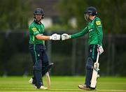 3 August 2023; Jared Wilson of North West Warriors, left, and team-mate Scott Macbeth bump fists during the Rario Inter-Provincial Trophy 2023 match between North West Warriors and Munster Reds at Pembroke Cricket Club in Dublin. Photo by Sam Barnes/Sportsfile