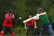 3 August 2023; Jared Wilson of North West Warriors bats watched by Munster wicketkeeper Peter Moor during the Rario Inter-Provincial Trophy 2023 match between North West Warriors and Munster Reds at Pembroke Cricket Club in Dublin. Photo by Sam Barnes/Sportsfile