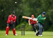 3 August 2023; Liam Doherty of North West Warriors bats watched by Munster wicketkeeper Peter Moor during the Rario Inter-Provincial Trophy 2023 match between North West Warriors and Munster Reds at Pembroke Cricket Club in Dublin. Photo by Sam Barnes/Sportsfile