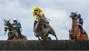 3 August 2023; Sir Argus, centre, with Brian Hayes up, jumps the first during the Guinness Beginners Steeplechase, alongside eventual winner Mars Harper, right, with Sam Ewing up, during day four of the Galway Races Summer Festival at Ballybrit Racecourse in Galway. Photo by Seb Daly/Sportsfile