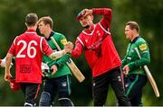 3 August 2023; Ben White of Munster Reds, right, and and team-mate Mike Frost celebrate after their side's victory in the Rario Inter-Provincial Trophy 2023 match between North West Warriors and Munster Reds at Pembroke Cricket Club in Dublin. Photo by Sam Barnes/Sportsfile