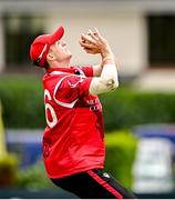 3 August 2023; Mike Frost of Munster Reds catches out Craig Young of North West Warriors during the Rario Inter-Provincial Trophy 2023 match between North West Warriors and Munster Reds at Pembroke Cricket Club in Dublin. Photo by Sam Barnes/Sportsfile