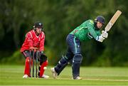 3 August 2023; Graham Hume of North West Warriors bats watched by Munster wicketkeeper Peter Moor during the Rario Inter-Provincial Trophy 2023 match between North West Warriors and Munster Reds at Pembroke Cricket Club in Dublin. Photo by Sam Barnes/Sportsfile