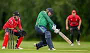 3 August 2023; Graham Hume of North West Warriors bats watched by Munster wicketkeeper Peter Moor during the Rario Inter-Provincial Trophy 2023 match between North West Warriors and Munster Reds at Pembroke Cricket Club in Dublin. Photo by Sam Barnes/Sportsfile
