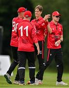 3 August 2023; Byron McDonough of Munster Reds, centre, celebrates a wicket with team-mates during the Rario Inter-Provincial Trophy 2023 match between North West Warriors and Munster Reds at Pembroke Cricket Club in Dublin. Photo by Sam Barnes/Sportsfile