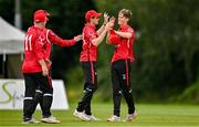 3 August 2023; Byron McDonough of Munster Reds, right, celebrates with team-mates after taking the wicket of William McClintock of North West Warriors during the Rario Inter-Provincial Trophy 2023 match between North West Warriors and Munster Reds at Pembroke Cricket Club in Dublin. Photo by Sam Barnes/Sportsfile