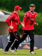 3 August 2023; Ben White of Munster Reds, right, celebrates with team-mate Nathan Maguire after catching out William McClintock of North West Warriors during the Rario Inter-Provincial Trophy 2023 match between North West Warriors and Munster Reds at Pembroke Cricket Club in Dublin. Photo by Sam Barnes/Sportsfile