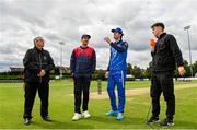 3 August 2023; Leinster Lightning captain George Dockrell, second from right, makes the toss, watched by, from left, match referee Phil Thompson, Northern Knights captain Mark Adair, and Sean Hussey of HBV Studios before the Rario Inter-Provincial Trophy 2023 match between Leinster Lightning and Northern Knights at Pembroke Cricket Club in Dublin. Photo by Sam Barnes/Sportsfile