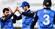 3 August 2023; Simi Singh of Leinster Lightning, left, celebrates with tream-mates George Dockrell, centre, and Lorcan Tucker after bowling Ruhan Pretorius of Northern Knights during the Rario Inter-Provincial Trophy 2023 match between Leinster Lightning and Northern Knights at Pembroke Cricket Club in Dublin. Photo by Sam Barnes/Sportsfile