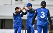 3 August 2023; Simi Singh of Leinster Lightning, left,  celebrates with tream-mates George Dockrell,  centre, and Lorcan Tucker after bowling Ruhan Pretorius of Northern Knights during the Rario Inter-Provincial Trophy 2023 match between Leinster Lightning and Northern Knights at Pembroke Cricket Club in Dublin. Photo by Sam Barnes/Sportsfile