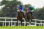 3 August 2023; The Big Doyen, left, with Kevin Sexton up, on their way to winning the Guinness Novice Hurdle, from second place What Path, right, with Paul Townend up, during day four of the Galway Races Summer Festival at Ballybrit Racecourse in Galway. Photo by Seb Daly/Sportsfile