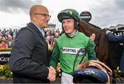 3 August 2023; Owner Simon Munir, left, congratulates jockey Paul Townend after winning the Guinness Galway Hurdle Handicap on Zarak The Brave during day four of the Galway Races Summer Festival at Ballybrit Racecourse in Galway. Photo by Seb Daly/Sportsfile