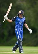 3 August 2023; Tim Tector of Leinster Lightning holds his bat aloft to acknowdge the crowd after bringing up  his half century of runs during the Rario Inter-Provincial Trophy 2023 match between Leinster Lightning and Northern Knights at Pembroke Cricket Club in Dublin. Photo by Sam Barnes/Sportsfile