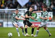 3 August 2023; Kristoffer Zachariassen of Ferencvaros in action against Gary O'Neill and Conan Noonan of Shamrock Rovers during the UEFA Europa Conference League Second Qualifying Round Second Leg match between Shamrock Rovers and Ferencvaros at Tallaght Stadium in Dublin. Photo by Harry Murphy/Sportsfile