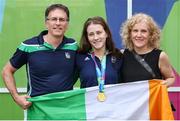 3 August 2023; Roisin Ni Riain of Ireland with her parents Seosamh O Riain and Marian Conroy after winning Gold in the Women's 100m Backstroke S13 Final during day four of the World Para Swimming Championships 2023 at Manchester Aquatics Centre in Manchester. Photo by Paul Greenwood/Sportsfile