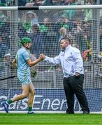 23 July 2023; Limerick goalkeeper shakes hands with umpire Tommy Redmond before the start of the second half the GAA Hurling All-Ireland Senior Championship final match between Kilkenny and Limerick at Croke Park in Dublin. Photo by Piaras Ó Mídheach/Sportsfile