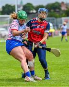 28 July 2023; Aly Harmutz of Coastal Virginia in action against Kristin Cardell of South East during the Camogie International Cup Final Etty Kelly Cup match between South East and Coastal Virginia on day five of the FRS Recruitment GAA World Games 2023 at Celtic Park in Derry. Photo by Piaras Ó Mídheach/Sportsfile
