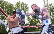 4 August 2023; Lewis Crocker, right, and Greyvin Mendoza during their welterweight bout during the Féile Fight Night at Falls Park in Belfast. Photo by Ramsey Cardy/Sportsfile