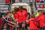 4 August 2023; Jonathan Afolabi of Bohemians is greeted by young supporters before the SSE Airtricity Men's Premier Division match between Bohemians and Drogheda United at Dalymount Park in Dublin. Photo by Seb Daly/Sportsfile