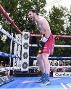 4 August 2023; Kieran Molloy celebrates defeating Sam O'Maison in the first round of their welterweight bout during the Féile Fight Night at Falls Park in Belfast. Photo by Ramsey Cardy/Sportsfile