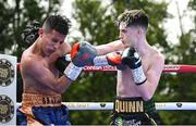 4 August 2023; Conor Quinn, right, and Bryan Castro during their super-flyweight bout during the Féile Fight Night at Falls Park in Belfast. Photo by Ramsey Cardy/Sportsfile