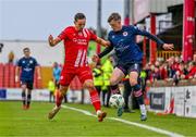 4 August 2023; Chris Forrester of St Patrick's Athletic is tackled by Lukas Browning of Sligo Rovers during the SSE Airtricity Men's Premier Division match between Sligo Rovers and St Patrick's Athletic at The Showgrounds in Sligo. Photo by Tyler Miller/Sportsfile