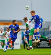 4 August 2023; Ryan Kelliher of Kerry FC in action against Waterford players Giles Phillips, left, and Andrew Baker during the SSE Airtricity Men's First Division match between Waterford and Kerry at RSC in Waterford. Photo by Michael P Ryan/Sportsfile
