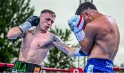 4 August 2023; Kurt Walker, left, and Jayro Fernando Duran during their super-featherweight bout during the Féile Fight Night at Falls Park in Belfast. Photo by Ramsey Cardy/Sportsfile
