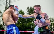 4 August 2023; Kurt Walker, right, and Jayro Fernando Duran during their super-featherweight bout during the Féile Fight Night at Falls Park in Belfast. Photo by Ramsey Cardy/Sportsfile