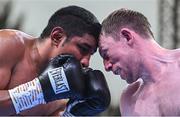 4 August 2023; Fearghus Quinn, right, and Ramiro Blanco during their middleweight bout during the Féile Fight Night at Falls Park in Belfast. Photo by Ramsey Cardy/Sportsfile