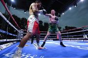 4 August 2023; Fearghus Quinn, right, and Ramiro Blanco during their middleweight bout during the Féile Fight Night at Falls Park in Belfast. Photo by Ramsey Cardy/Sportsfile