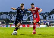 4 August 2023; Tommy Lonergan of St Patrick's Athletic in action against Stefan Radosavljevic of Sligo Rovers during the SSE Airtricity Men's Premier Division match between Sligo Rovers and St Patrick's Athletic at The Showgrounds in Sligo. Photo by Tyler Miller/Sportsfile