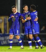 4 August 2023; Ronan Coughlan of Waterford, centre, celebrates after scoring his side's third goal with teammates Barry Baggley, left, and Serge Atakayi during the SSE Airtricity Men's First Division match between Waterford and Kerry at RSC in Waterford. Photo by Michael P Ryan/Sportsfile