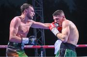 4 August 2023; Sean McComb, left, and Alejandro Moya during their WBO European Super-Lightweight title bout during the Féile Fight Night at Falls Park in Belfast. Photo by Ramsey Cardy/Sportsfile