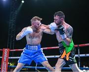 4 August 2023; Padraig McCrory, right, and Steed Woodall, left during their super-middleweight bout during the Féile Fight Night at Falls Park in Belfast. Photo by Ramsey Cardy/Sportsfile