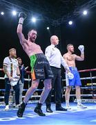 4 August 2023; Padraig McCrory is declared victorious after beating Steed Woodall in their super-middleweight bout during the Féile Fight Night at Falls Park in Belfast. Photo by Ramsey Cardy/Sportsfile