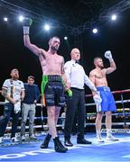 4 August 2023; Padraig McCrory is declared victorious after beating Steed Woodall in their super-middleweight bout during the Féile Fight Night at Falls Park in Belfast. Photo by Ramsey Cardy/Sportsfile