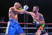 4 August 2023; Padraig McCrory, right, and Steed Woodall during their super-middleweight bout during the Féile Fight Night at Falls Park in Belfast. Photo by Ramsey Cardy/Sportsfile