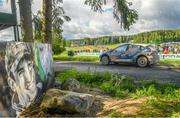 5 August 2023; Eamonn Kelly and Conor Mohan from Ireland in their Hyundai i20 N in their Ford Fiesta Rally 3 pass a poster of the late Irish rally driver Craig Breen during Stage 13 Rapsula of the FIA World Rally Championship Secto Rally in Jyväskylä, Finland. Photo by Philip Fitzpatrick/Sportsfile